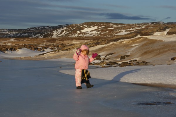 Exploring the frozen river, very carefully, on a weirdly warm November day when the snow half-melted.