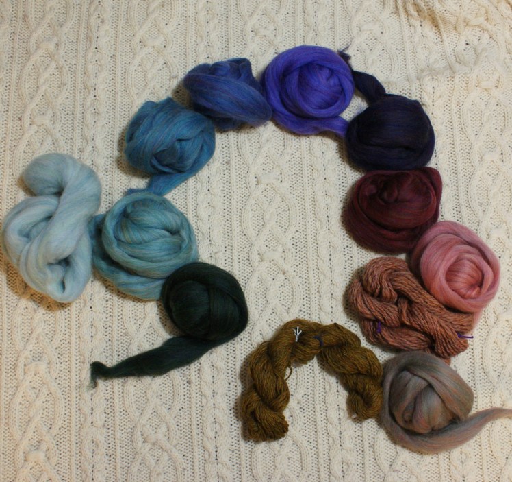 All twelve colors in their relative positions on the color wheel. There's really a much bigger gap in the warm colors; the dark red and dark green should be across from each other.